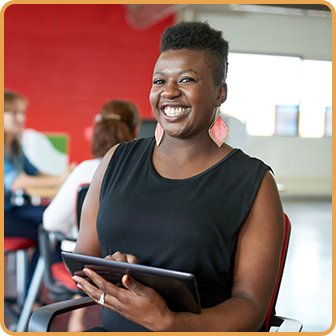 Smiling Woman Holding Tablet
